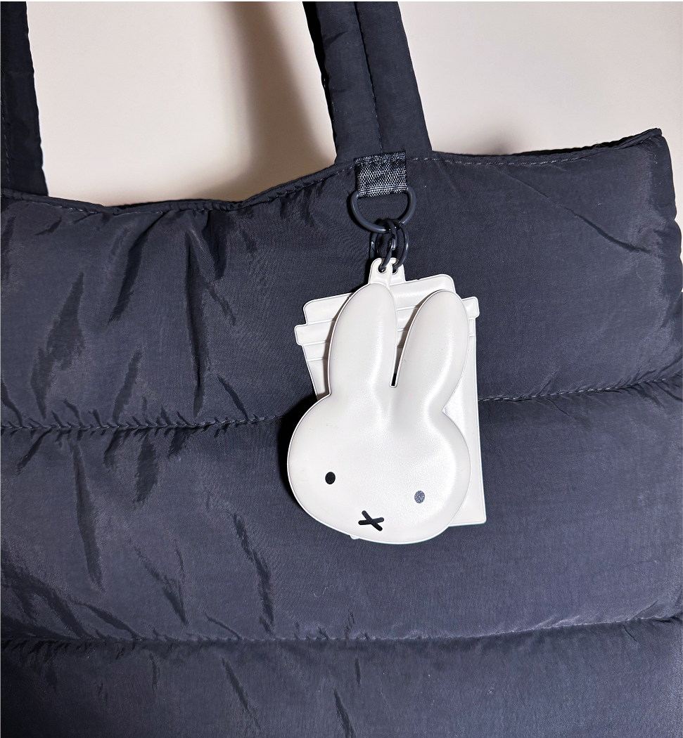 Close up image of the miffy keychain on the bag.