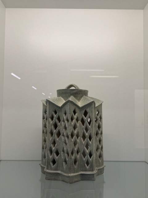 This is an image of a ceramic work made by a Sheridan ceramic student with clay which was fired then ceramic glaze added to achieve the reflective look.