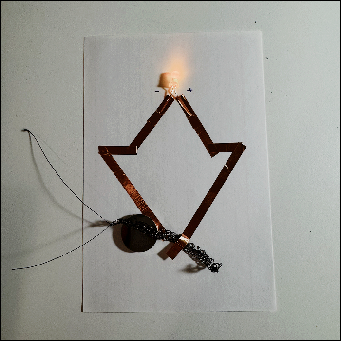 Testing if the conductive thread works bu connecting it to a previously built circuit as a proof of concept.