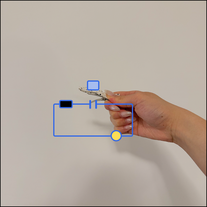 This is an example of an clothing based interaction, based on the ribbon's opening motion, the switch is open when the hinge is engaged.