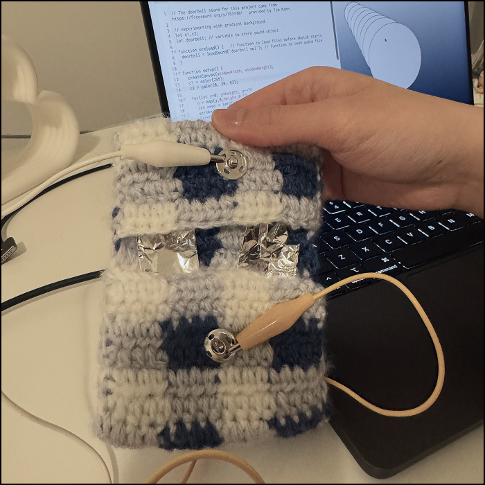 Showing the small object used to test the code, the aluminium foil and 2 grommets are conductive wrapped around a non conductive tool, meaning they all act as 4 trigger points