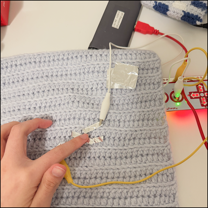Testing the application of different buttons interating together made of aluminium foil folding in