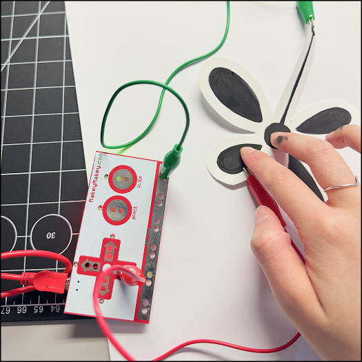 Connecting conductive part of the paper to the makey-makey to test the bending motion and possible interactions with the petal and rounded shape.