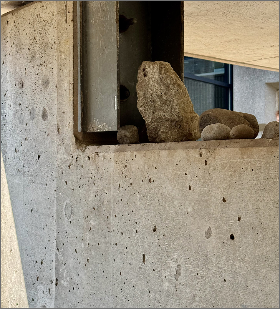 Concrete surface outside of the S building under the bridge